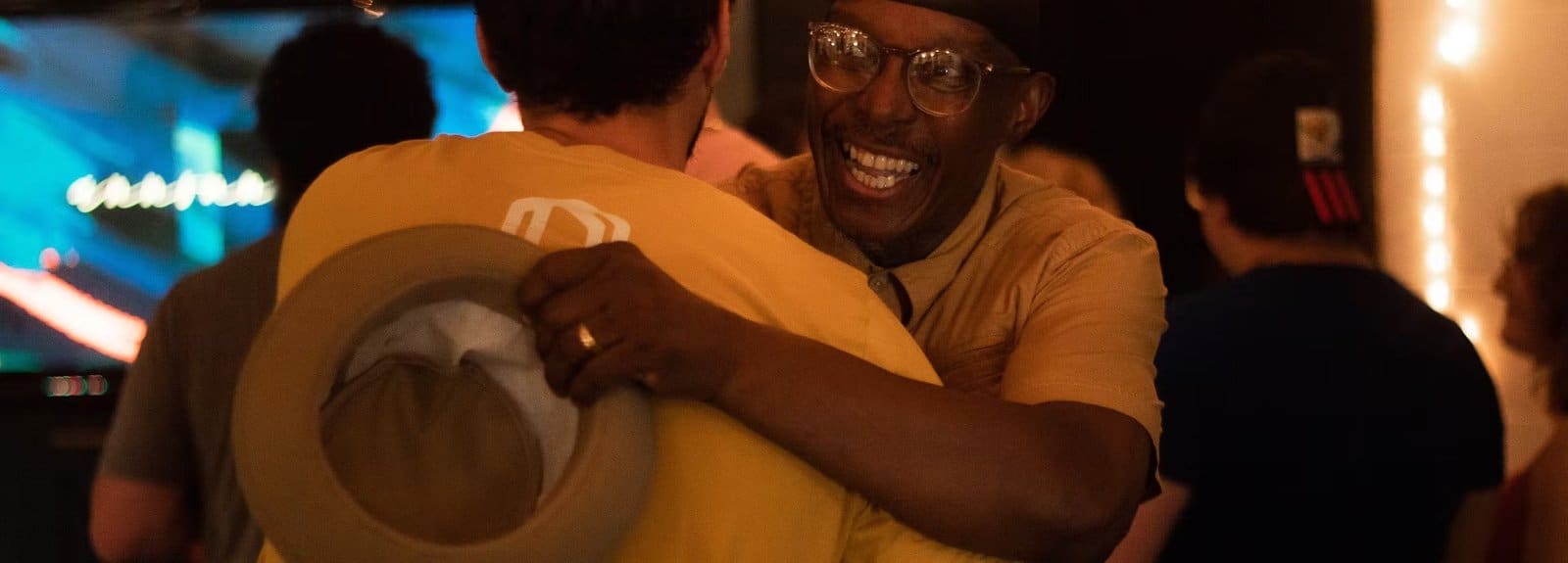 Members embracing after worship